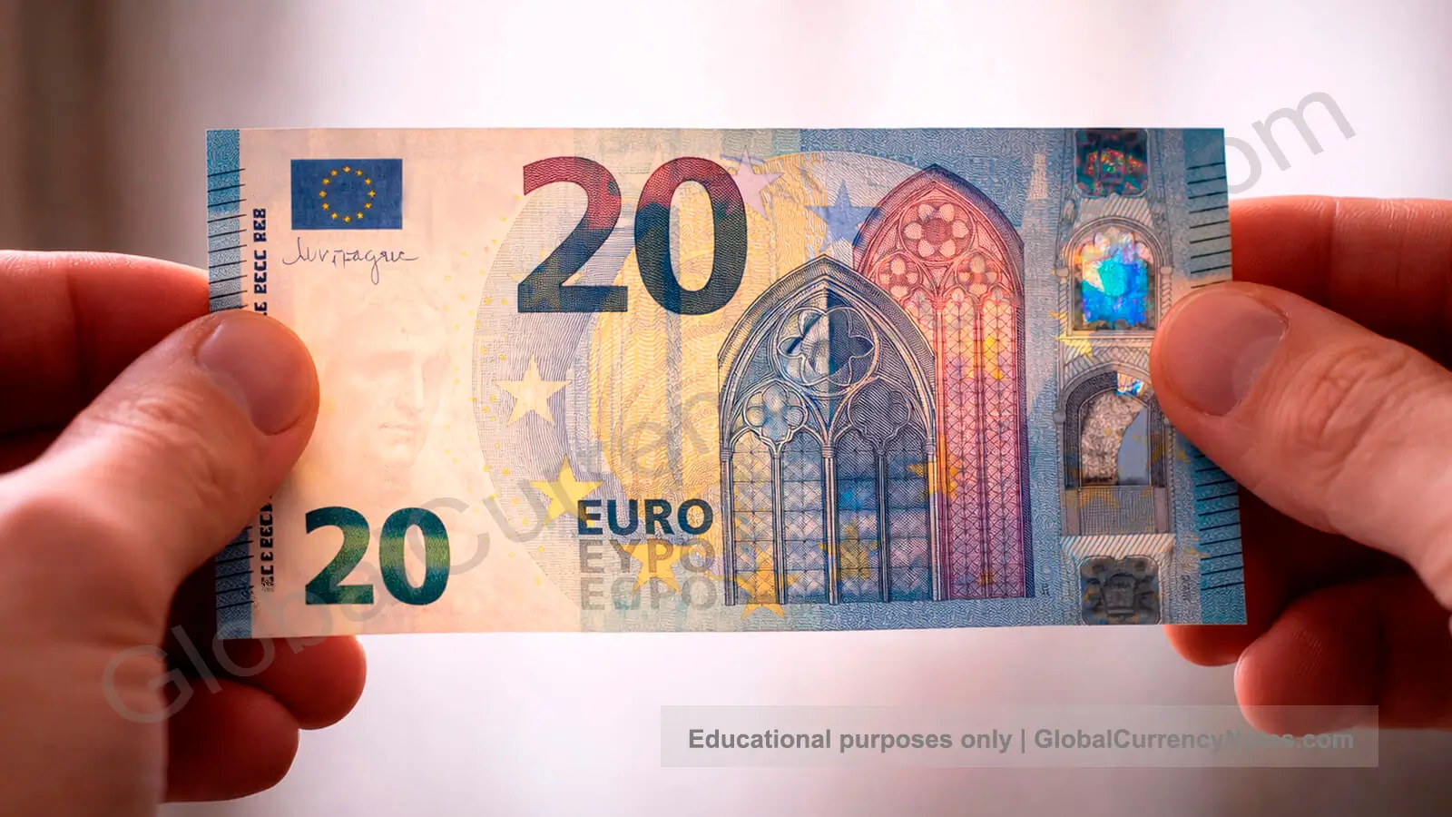 Person checking banknote security features against the light to see watermark and security thread